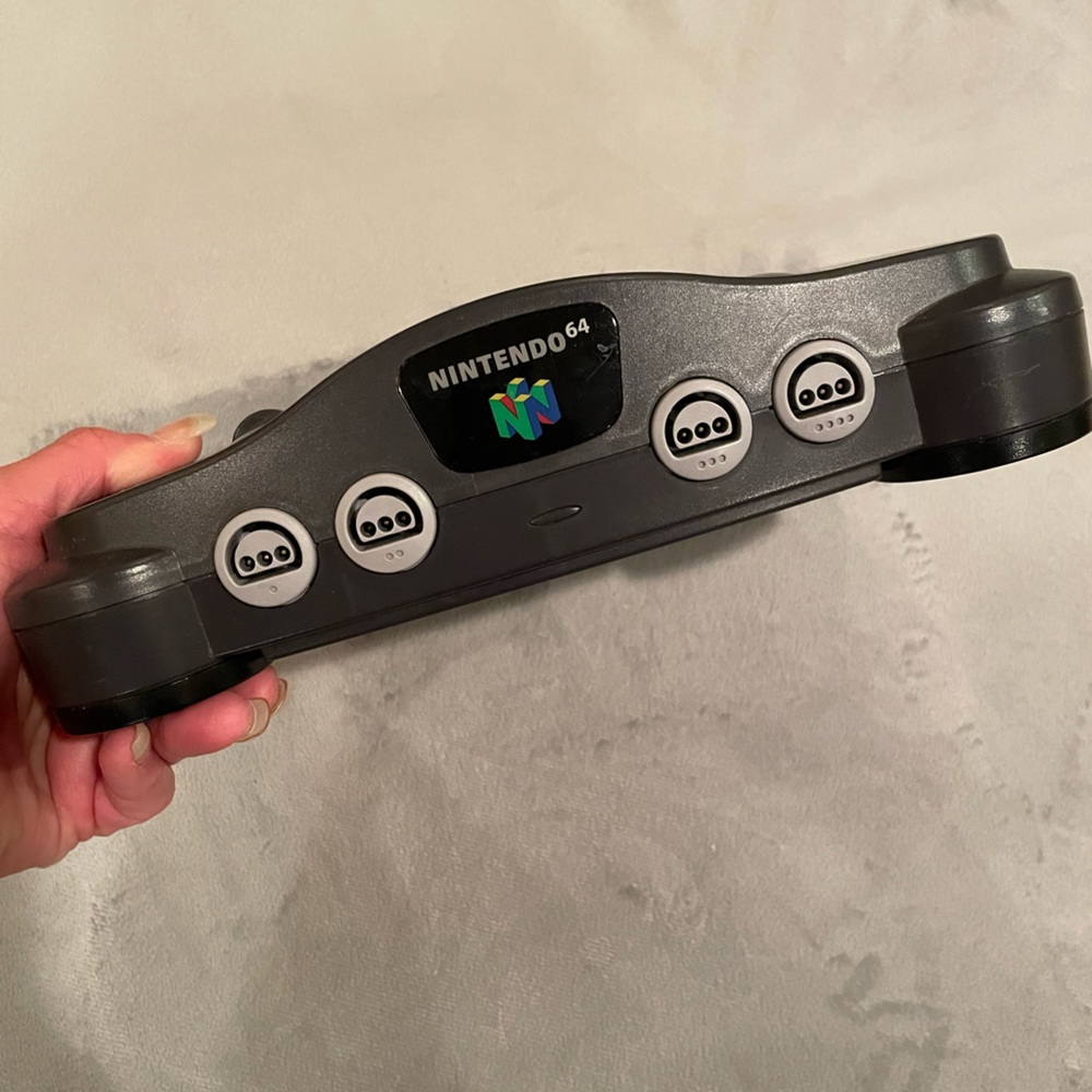 Gently used Nintendo 64 with power cord only. No coax cord.